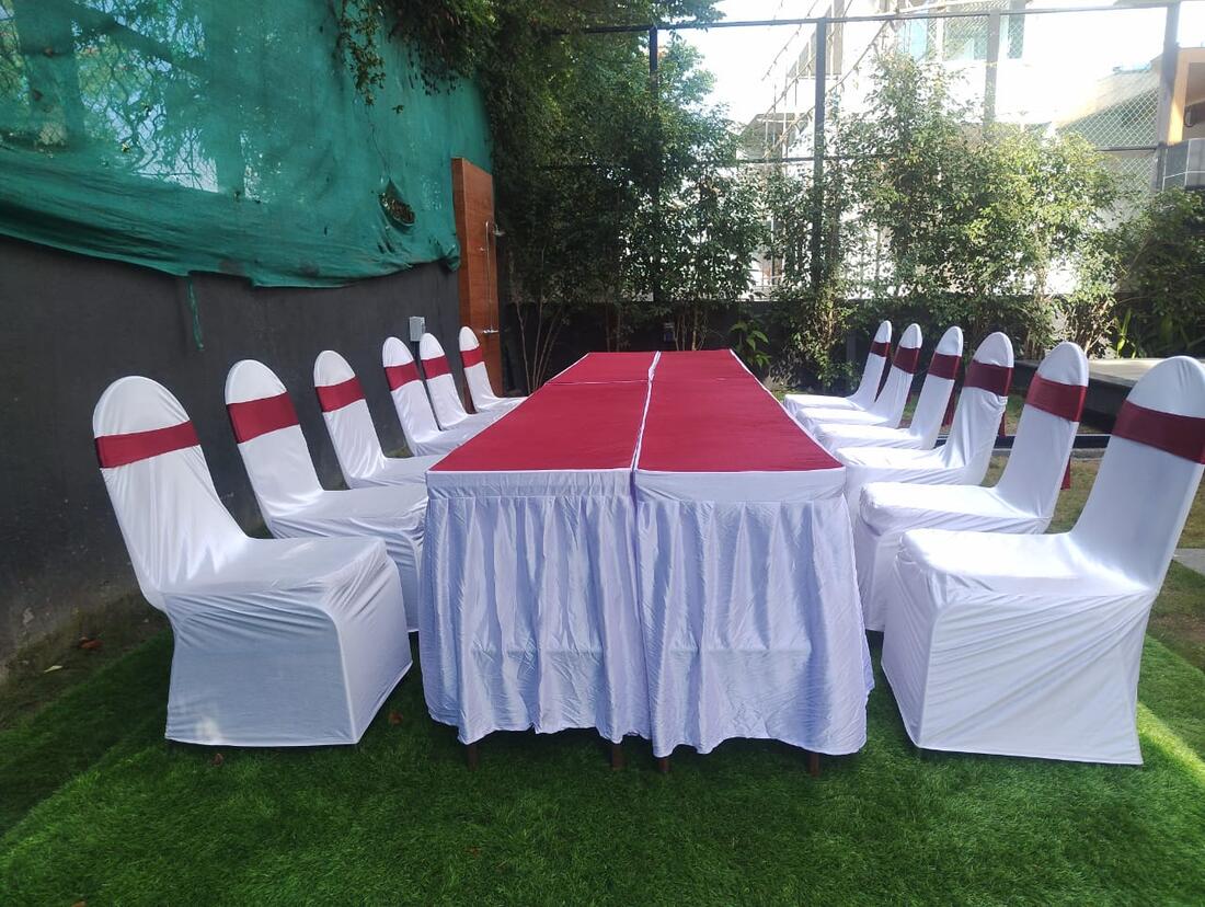 Close detail of a white floral wedding mandap pillar